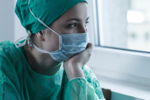 Photo of surgeon after surgery looking concerned